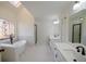 Bright bathroom featuring a soaking tub, glass shower, and double sink vanity at 1190 Saint Ives Ct, Suwanee, GA 30024