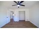 A large bedroom with a ceiling fan, great natural light and a large closet at 1190 Saint Ives Ct, Suwanee, GA 30024