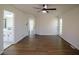 Large bedroom with hardwood flooring has easy access to the connected bathroom at 1190 Saint Ives Ct, Suwanee, GA 30024