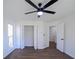 A good sized bedroom features neutral walls and a large closet at 1190 Saint Ives Ct, Suwanee, GA 30024