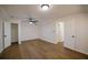 Spacious bedroom with ceiling fan, modern flooring, and white walls at 1190 Saint Ives Ct, Suwanee, GA 30024