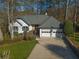 Beautiful one-story home with a lush front yard at 1190 Saint Ives Ct, Suwanee, GA 30024