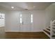 Welcoming foyer with wood flooring, staircase, and natural light offers a glimpse into the home's open layout at 1190 Saint Ives Ct, Suwanee, GA 30024