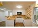 Cozy kitchen featuring granite countertops, white cabinetry, and stainless steel appliances at 1190 Saint Ives Ct, Suwanee, GA 30024
