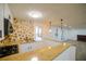 Open concept kitchen with granite countertops and sleek appliances is perfect for entertaining at 1190 Saint Ives Ct, Suwanee, GA 30024