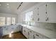 Bright kitchen with white cabinets, subway tile backsplash, and stainless appliances at 1190 Saint Ives Ct, Suwanee, GA 30024