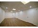 Expansive living area with wood-look floors and neutral paint, great for flexible use at 1190 Saint Ives Ct, Suwanee, GA 30024