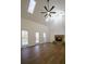 Bright living room featuring vaulted ceilings, skylights, a cozy fireplace, and hardwood floors at 1190 Saint Ives Ct, Suwanee, GA 30024