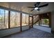 Covered screened in porch, natural light, and view to trees at 1190 Saint Ives Ct, Suwanee, GA 30024