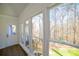 Bright sunroom with hardwood floors, large windows, and a lovely view of the backyard at 1190 Saint Ives Ct, Suwanee, GA 30024
