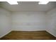 Spacious walk-in closet featuring wood floors and ample shelving for organized storage at 1190 Saint Ives Ct, Suwanee, GA 30024