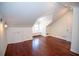 Attic space featuring wood floors, white walls, ample lighting, and a built-in seating area beneath a window at 1251 Cumberland Ne Rd, Atlanta, GA 30306