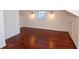 Attic space featuring wood floors, white walls, and ample lighting at 1251 Cumberland Ne Rd, Atlanta, GA 30306