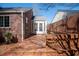 View of wooden back deck and brick house with lattice railing, great for entertaining at 1251 Cumberland Ne Rd, Atlanta, GA 30306