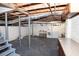 Unfinished basement with concrete floors, painted walls, laundry area, and exposed utilities at 1251 Cumberland Ne Rd, Atlanta, GA 30306