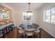 Dining room features a modern chandelier and dining table at 1251 Cumberland Ne Rd, Atlanta, GA 30306