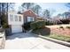 Charming brick home featuring a driveway and lovely landscaping at 1251 Cumberland Ne Rd, Atlanta, GA 30306