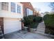 Charming brick home featuring a one-car garage and manicured landscaping at 1251 Cumberland Ne Rd, Atlanta, GA 30306