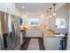 Well-lit kitchen with stainless refrigerator and oven, granite countertops, and white cabinets at 1251 Cumberland Ne Rd, Atlanta, GA 30306