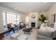 Bright living room features a fireplace, large windows, and stylish furniture at 1251 Cumberland Ne Rd, Atlanta, GA 30306