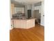 Spacious kitchen featuring an island, ample counter space and cabinet storage at 241 Nacoochee Dr, Woodstock, GA 30188