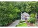 Picturesque aerial view of home nestled in lush greenery at 2690 Valvedere Dr, Brookhaven, GA 30319