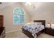 Comfortable bedroom with a large window, ceiling fan, and ample natural light at 2690 Valvedere Dr, Brookhaven, GA 30319