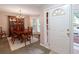 Elegant dining room featuring a chandelier, hardwood floors, and lots of natural light at 2690 Valvedere Dr, Brookhaven, GA 30319