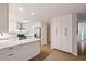 Bright kitchen features stainless steel appliances, white cabinets, marble countertops, and a breakfast bar at 2690 Valvedere Dr, Brookhaven, GA 30319