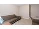 The living room boasts neutral colors and a soft carpet, furnished with a comfortable gray sofa set at 2690 Valvedere Dr, Brookhaven, GA 30319