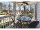Relaxing covered patio with a ceiling fan and outdoor dining set, perfect for enjoying the neighborhood views at 2690 Valvedere Dr, Brookhaven, GA 30319
