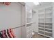 The walk-in closet is complete with ample storage and shelving units at 2690 Valvedere Dr, Brookhaven, GA 30319
