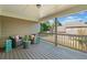 Inviting covered back porch with cozy seating and a view of the lush backyard at 6350 Bridge Brook Ovlk, Cumming, GA 30028