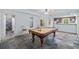 Basement game room includes pool table, kitchenette, and access to a bathroom and other rooms at 6350 Bridge Brook Ovlk, Cumming, GA 30028
