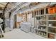 Unfinished basement with exposed ducts and pipes, laundry, and space for storage at 6350 Bridge Brook Ovlk, Cumming, GA 30028