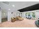 Basement space featuring a large sofa and sitting chairs with access to other rooms at 6350 Bridge Brook Ovlk, Cumming, GA 30028