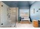 Modern bathroom featuring a frameless glass shower with stylish tile and a bench at 6350 Bridge Brook Ovlk, Cumming, GA 30028