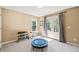 Versatile bonus room with neutral colors, window, and gym equipment at 6350 Bridge Brook Ovlk, Cumming, GA 30028