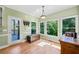Bright breakfast nook featuring hardwood floors, neutral paint, and door to deck at 6350 Bridge Brook Ovlk, Cumming, GA 30028