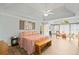 Spacious main bedroom suite featuring a tray ceiling, ceiling fan and lots of natural light at 6350 Bridge Brook Ovlk, Cumming, GA 30028