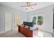 Bright office with large window providing natural light, neutral paint and plush carpet at 6350 Bridge Brook Ovlk, Cumming, GA 30028