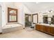 Bright bathroom features a soaking tub, walk-in shower, and a dual sink vanity at 6575 Roundhill Ct, Cumming, GA 30040