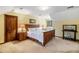 Inviting bedroom featuring warm lighting, ample natural light, and a comfortable atmosphere at 6575 Roundhill Ct, Cumming, GA 30040