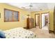 Comfortable bedroom with natural light with access to the bathroom at 6575 Roundhill Ct, Cumming, GA 30040