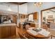 Charming dining area with a view into the adjacent living spaces and kitchen at 6575 Roundhill Ct, Cumming, GA 30040