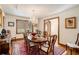 Formal dining room with chandelier and elegant furniture, perfect for entertaining at 6575 Roundhill Ct, Cumming, GA 30040