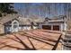 Stunning home featuring a large brick driveway and attached two-car garage at 6575 Roundhill Ct, Cumming, GA 30040