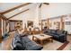 Bright living room featuring hardwood floors, vaulted ceilings, comfortable seating, and stylish decor at 6575 Roundhill Ct, Cumming, GA 30040