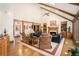 Spacious living room featuring vaulted ceilings, hardwood floors, fireplace, and ample seating at 6575 Roundhill Ct, Cumming, GA 30040