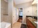 Clean bathroom with tiled shower-tub, granite countertop vanity, and tiled floors at 855 Peachtree Ne St # 1911, Atlanta, GA 30308
